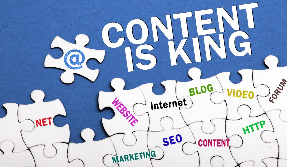 A blue background saying content is king with white puzzle pieces with different marketing terms and platforms on each puzzle piece