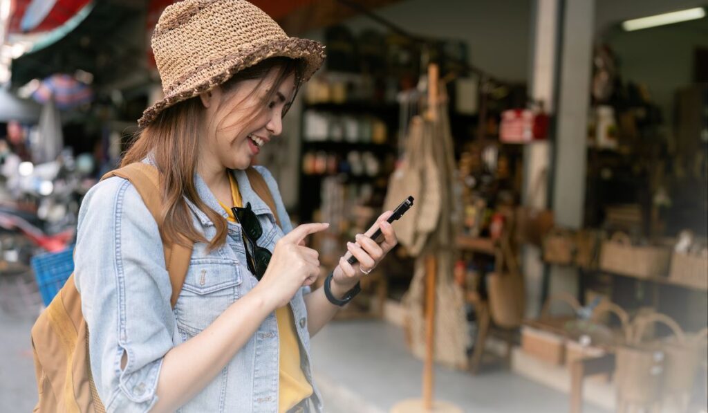 Zen 9 Marketing Local SEO woman who walked to a local store based on her smartphone that she is holding