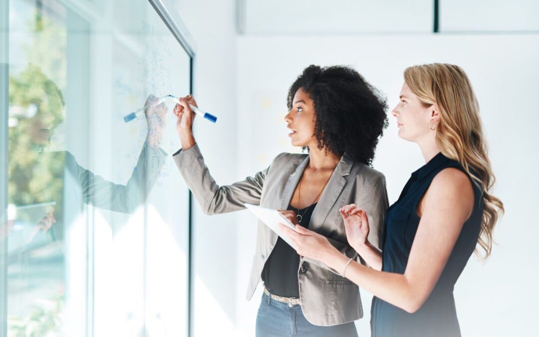 Zen 9 Marketing Storybranding Sales Funnel two women writing on a white board creating a story board for a brand