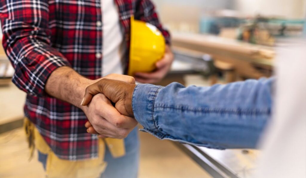 Zen 9 Marketing Marketing for the trades two people shaking hands obvious construction worker attire