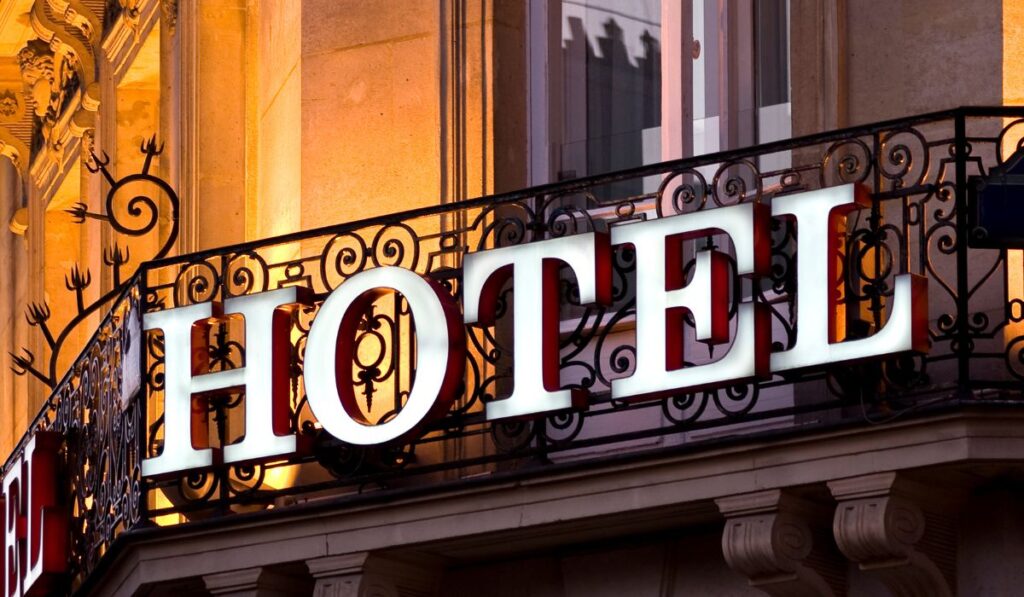 Canva-Zen 9 Marketing SEO agency for hotels old fashioned looking hotel sign that simply says hotel