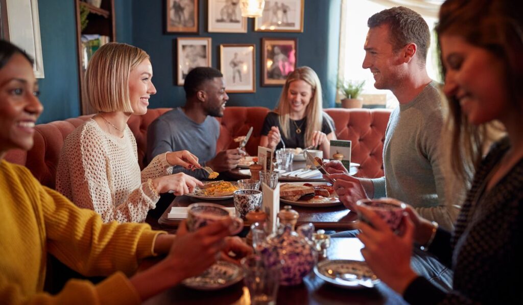 Canva-Zen 9 Marketing SEO for restaurants busy restaurant with several groups of people visible in the dining area