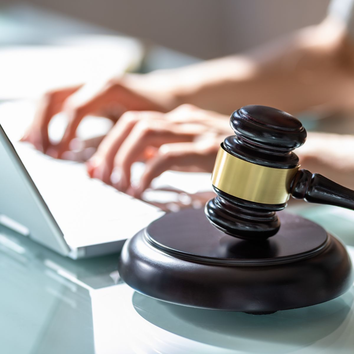 Canva-Zen 9 Marketing Content Strategy Case Study female behind a laptop typing with a gavel in the foreground