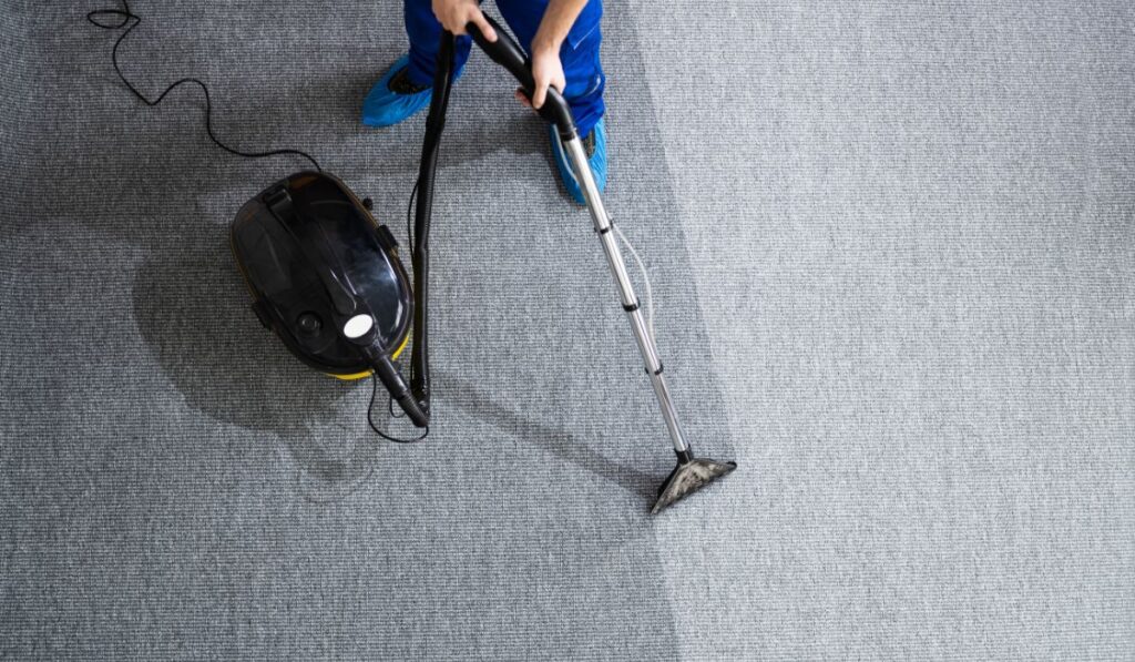 Canva-Zen 9 Marketing professional carpet cleaner using their machines on a dirty gray carpet